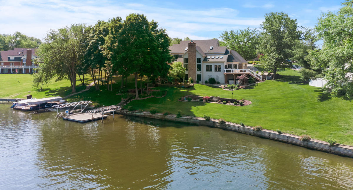 Waterfront estate home in Easternshore Estates on Lake Saint Louis with private dock and lakefront yard